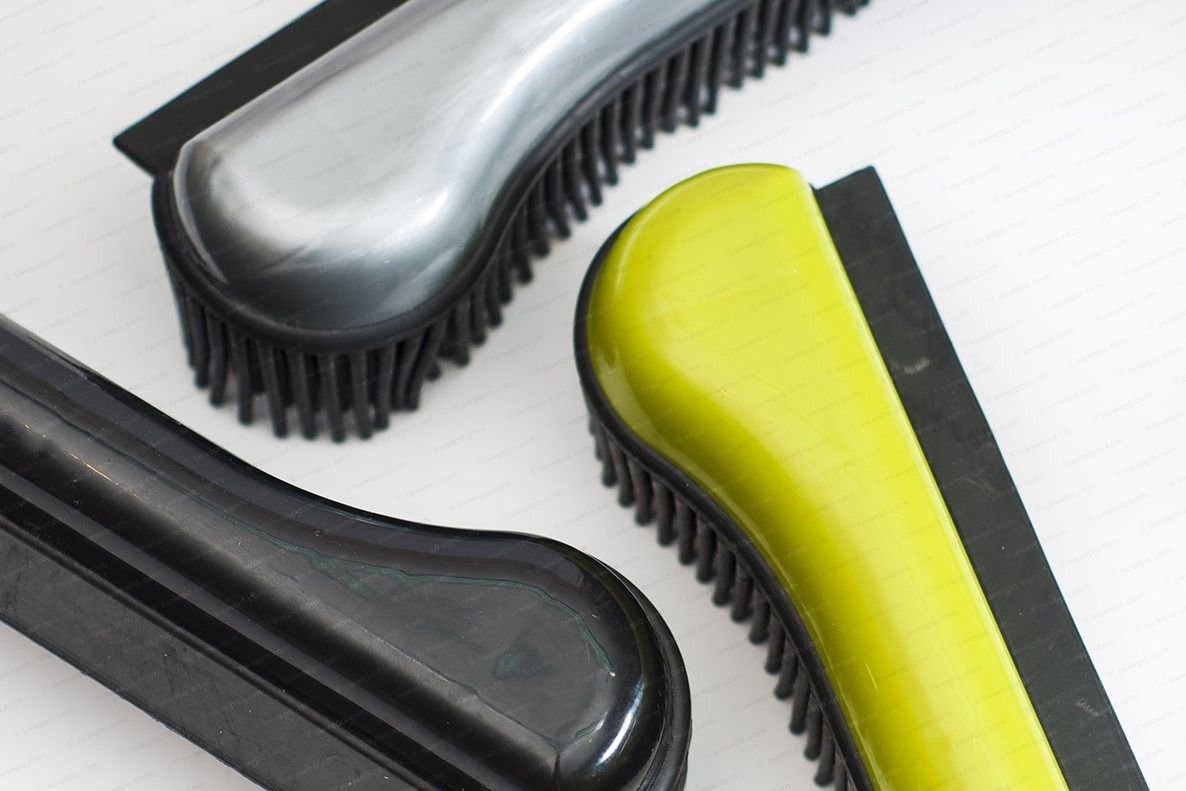 Three Sweepa natural rubber hand brushes